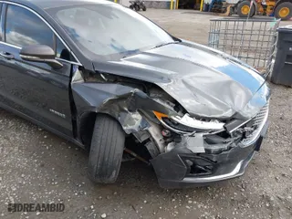2019 Ford Fusion Hybrid Titanium with VIN 3FA6P0RU8KR273062, listed as a IAAI auction lot 41814102 with 70,877 mi miles. Bid and sale history available at carsss.com. Image 6.
