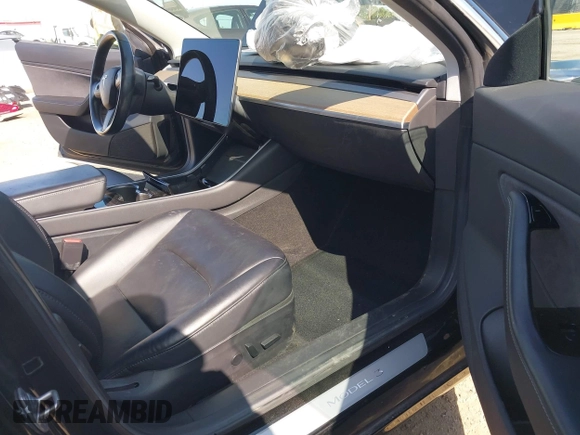 2018 Tesla Model 3 Long Range Battery with VIN 5YJ3E1EA7JF057031, listed as a IAAI auction lot 42139832 with 92,618 mi miles and . Bid and sale history available at DreamBid. Image 5.