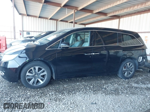 2014 Honda Odyssey Touring with VIN 5FNRL5H94EB110590, listed as a IAAI auction lot 42092929 with 242,338 mi miles and . Bid and sale history available at DreamBid. Image 15.