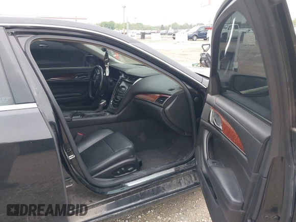 2014 Cadillac CTS Luxury AWD with VIN 1G6AX5SX9E0197395, listed as a IAAI auction lot 42211452 with 90,657 mi miles and . Bid and sale history available at DreamBid. Image 5.