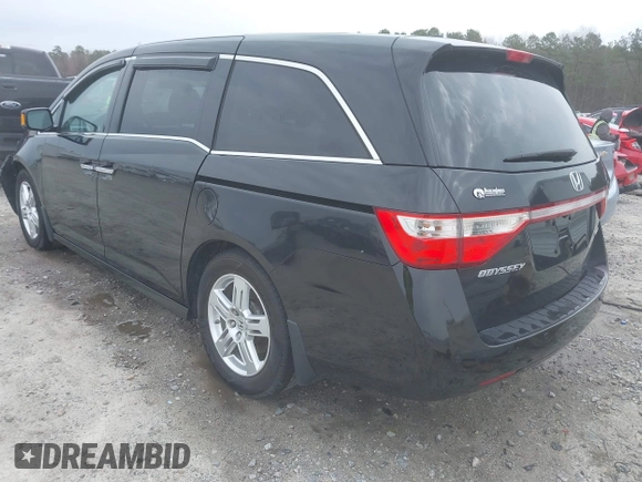 2012 Honda Odyssey Touring with VIN 5FNRL5H96CB058828, listed as a IAAI auction lot 41731389 with 152,295 mi miles and . Bid and sale history available at DreamBid. Image 3.