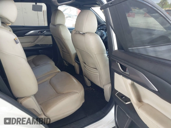2016 Mazda CX-9 Grand Touring with VIN JM3TCADYXG0113563, listed as a IAAI auction lot 42593120 with 237,696 mi miles and . Bid and sale history available at DreamBid. Image 8.