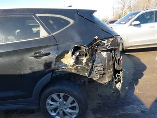 2019 Hyundai Tucson Value with VIN KM8J33A4XKU979791, listed as a IAAI auction lot 41255630 with 90,807 mi miles. Bid and sale history available at carsss.com. Image 6.