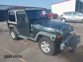 2002 Jeep Wrangler X z VIN 1J4FA39S72P733034, wystawiony jako IAAI lot #42659447 z przebiegiem 200 786 mil mil oraz . Historia ofert i sprzedaży dostępna na DreamBid. Obrazek 1.