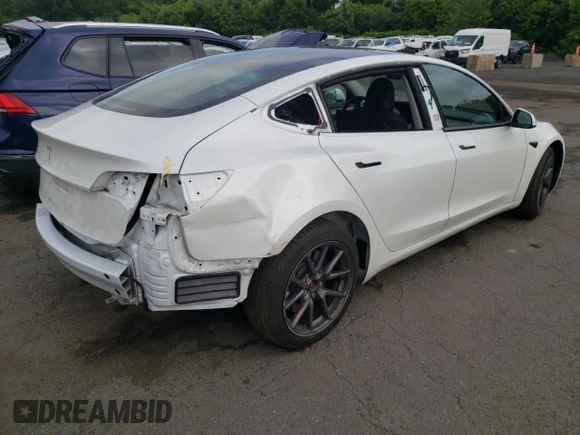 2023 Tesla Model 3 with VIN 5YJ3E1EA6PF563331, listed as a Copart auction lot 61124715 with 26,198 mi miles and Salvage title. Bid and sale history available at DreamBid. Image 3.