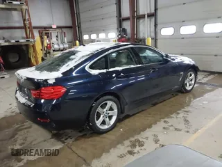 2015 BMW 4 Series 428i xDrive with VIN WBA4A7C57FD414955, listed as a IAAI auction lot 41609214 with 69,125 mi miles and . Bid and sale history available at DreamBid. Image 4.