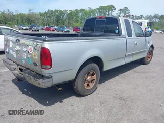 2002 Ford F-150 XL with VIN 1FTRX17W22NA55784, listed as a IAAI auction lot 41958686 with 278,064 mi miles. Bid and sale history available at carsss.com. Image 4.