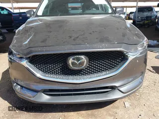 2021 Mazda CX-5 Touring with VIN JM3KFACM2M1313750, listed as a IAAI auction lot 41762938 with 68,503 mi miles. Bid and sale history available at carsss.com. Image 12.