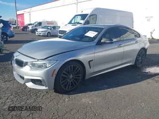 2015 BMW 4 Series 428i with VIN WBA4A5C58FG051293, listed as a IAAI auction lot 41255541 with 60,737 mi miles and . Bid and sale history available at DreamBid. Image 18.