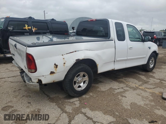 2002 Ford F-150 XL with VIN 1FTRX17L52KC49698, listed as a Copart auction lot 54307145 with 254,394 mi miles and Salvage title. Bid and sale history available at DreamBid. Image 3.