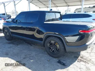 2022 Rivian R1T Launch Edition z VIN 7FCTGAAL1NN010340, wystawiony jako IAAI lot #41656762 z przebiegiem Nie podano mil oraz . Historia ofert i sprzedaży dostępna na DreamBid. Obrazek 3.