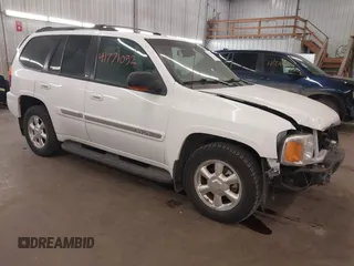 2003 GMC Envoy SLT with VIN 1GKDT13S332222847, listed as a IAAI auction lot 41771052 with 203,699 mi miles. Bid and sale history available at carsss.com. Image 1.