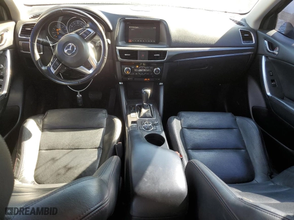 2016 Mazda CX-5 Grand Touring with VIN JM3KE4DY7G0871769, listed as a Copart auction lot 75835094 with 142,180 mi miles and Salvage Title. Bid and sale history available at carsss.com. Image 8.