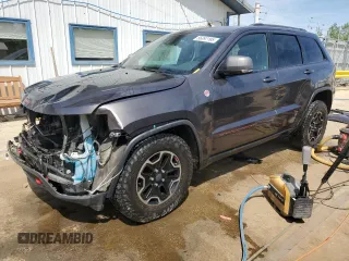 2017 Jeep Grand Cherokee Trailhawk with VIN 1C4RJFLGXHC654112, listed as a Copart auction lot 56397195 with 168,136 mi miles and Salvage title. Bid and sale history available at DreamBid. Image 1.