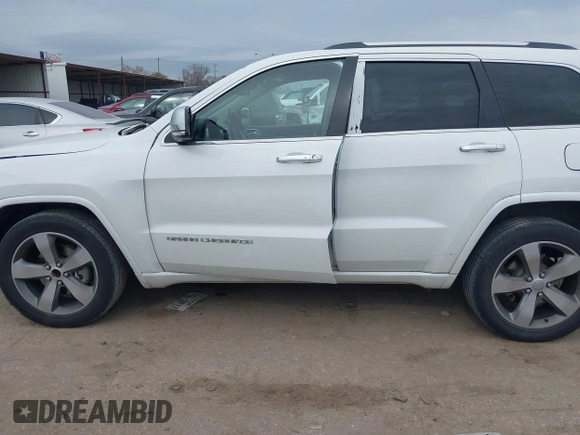 2014 Jeep Grand Cherokee Overland with VIN 1C4RJECG3EC266659, listed as a IAAI auction lot 41363419 with 142,896 mi miles. Bid and sale history available at carsss.com. Image 15.
