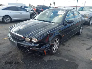 2004 Jaguar X-Type with VIN SAJEA51C44WD56659, listed as a IAAI auction lot 41712395 with Not Provided miles and . Bid and sale history available at DreamBid. Image 2.