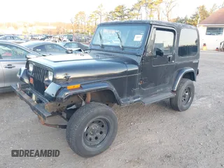 1990 Jeep Wrangler with VIN 2J4FY29T2LJ543655, listed as a IAAI auction lot 41766772 with 999,999 mi miles. Bid and sale history available at carsss.com. Image 2.