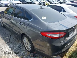 2016 Ford Fusion SE Hybrid z VIN 3FA6P0LU0GR218685, wystawiony jako IAAI lot #42550930 z przebiegiem 178 041 mil mil oraz . Historia ofert i sprzedaży dostępna na DreamBid. Obrazek 3.