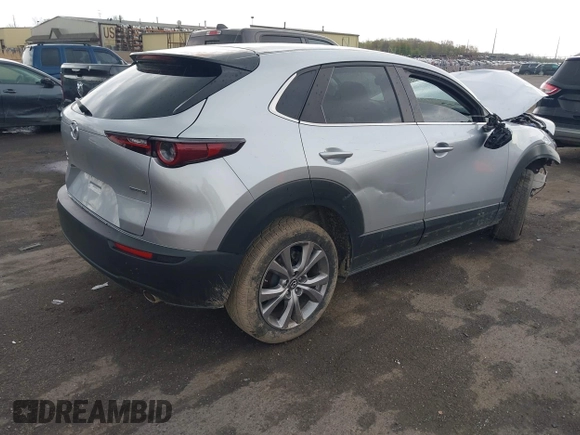 2021 Mazda CX-30 Preferred with VIN 3MVDMBCL6MM240663, listed as a IAAI auction lot 42165803 with 52,262 mi miles and . Bid and sale history available at DreamBid. Image 4.