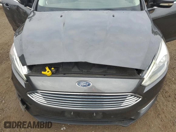 2017 Ford Focus Titanium z VIN 1FADP3N29HL240527, wystawiony jako Copart lot #62891695 z przebiegiem 126 926 mil mil oraz Szkoda całkowita • Salvage title. Historia ofert i sprzedaży dostępna na DreamBid. Obrazek 11.
