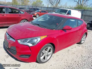 2014 Hyundai Veloster with VIN KMHTC6AD2EU214847, listed as a IAAI auction lot 42067728 with 77,421 mi miles. Bid and sale history available at carsss.com. Image 2.