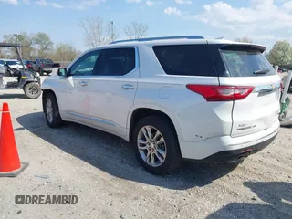 2018 Chevrolet Traverse High Country with VIN 1GNEVKKW9JJ111962, listed as a IAAI auction lot 42118324 with 104,311 mi miles and . Bid and sale history available at DreamBid. Image 3.