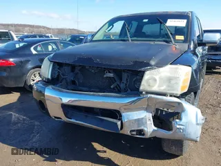 2004 Nissan Titan LE with VIN 1N6AA07A44N591357, listed as a IAAI auction lot 41464024 with 296,954 mi miles and . Bid and sale history available at DreamBid. Image 6.