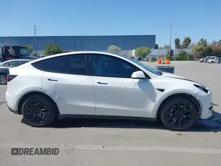 2021 Tesla Model Y Long Range with VIN 5YJYGDEEXMF280480, listed as a IAAI auction lot 41993633 with 69,579 mi miles. Bid and sale history available at carsss.com. Image 14.