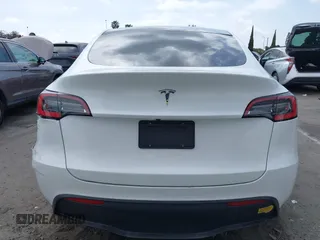 2021 Tesla Model Y Long Range with VIN 5YJYGDEE3MF081304, listed as a IAAI auction lot 42119270 with 90,521 mi miles. Bid and sale history available at carsss.com. Image 16.