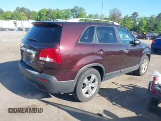 2012 Kia Sorento EX with VIN 5XYKUDA23CG206609, listed as a IAAI auction lot 42142072 with 162,574 mi miles. Bid and sale history available at carsss.com. Image 4.