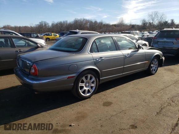 2004 Jaguar XJ with VIN SAJWA71C74SG34056, listed as a Copart auction lot 80083014 with 0 mi miles and Salvage Title. Bid and sale history available at carsss.com. Image 3.