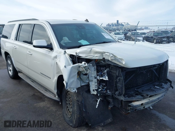 2015 Chevrolet Suburban LT with VIN 1GNSKJKC0FR309866, listed as a IAAI auction lot 41743848 with 220,778 mi miles and . Bid and sale history available at DreamBid. Image 1.
