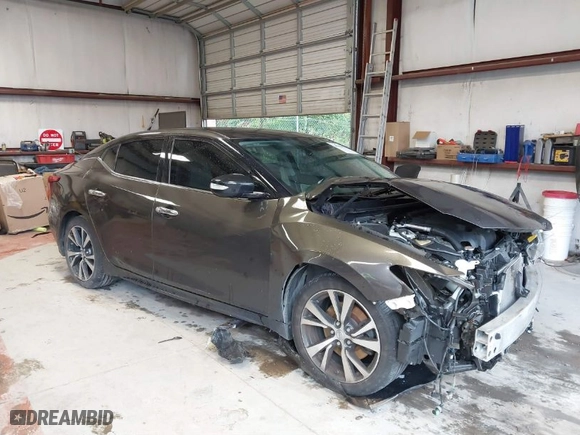 2016 Nissan Maxima 3.5 Platinum with VIN 1N4AA6APXGC447613, listed as a IAAI auction lot 40048427 with 100,142 mi miles. Bid and sale history available at carsss.com. Image 1.