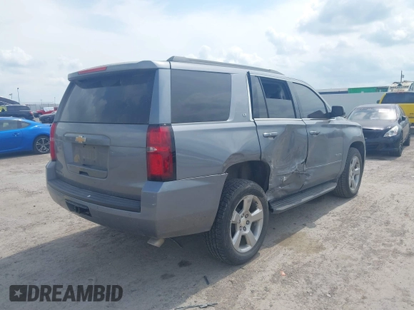 2019 Chevrolet Tahoe LT z VIN 1GNSCBKC8KR406519, wystawiony jako IAAI lot #42145021 z przebiegiem 74 694 mil mil oraz . Historia ofert i sprzedaży dostępna na DreamBid. Obrazek 4.
