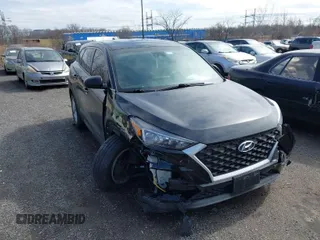 2019 Hyundai Tucson SE with VIN KM8J2CA46KU977863, listed as a IAAI auction lot 41704318 with 23,076 mi miles. Bid and sale history available at carsss.com. Image 1.