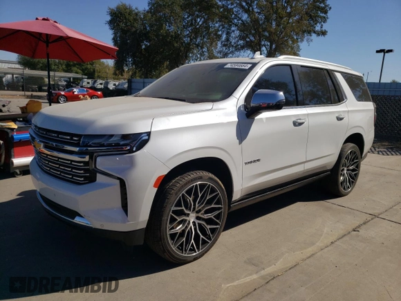 2023 Chevrolet Tahoe Premier with VIN 1GNSCSKD6PR119132, listed as a Copart auction lot 74594664 with 27,716 mi miles and Salvage title. Bid and sale history available at DreamBid. Image 1.
