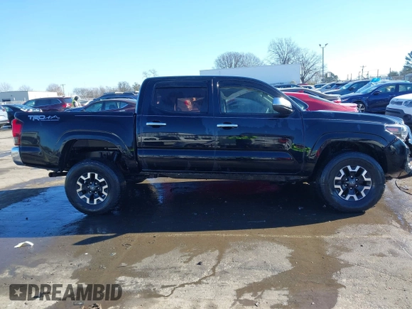 2018 Toyota Tacoma SR with VIN 5TFCZ5ANXJX124991, listed as a IAAI auction lot 41136867 with 57,980 mi miles and . Bid and sale history available at carsss.com. Image 13.