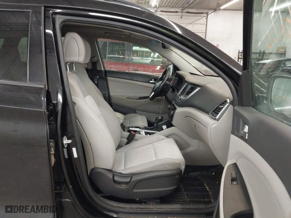 2018 Hyundai Tucson Value with VIN KM8J3CA28JU648236, listed as a IAAI auction lot 41161221 with 104,057 mi miles. Bid and sale history available at carsss.com. Image 5.