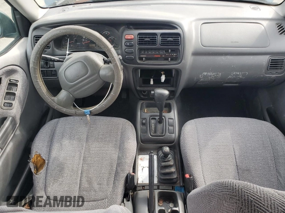 1999 Suzuki Grand Vitara JLX z VIN JS3TD62V0X4124366, wystawiony jako Copart lot #50885055 z przebiegiem 204 168 mil mil oraz Szkoda całkowita • Salvage title. Historia ofert i sprzedaży dostępna na DreamBid. Obrazek 8.