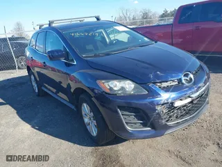 2010 Mazda CX-7 SV with VIN JM3ER2W57A0345450, listed as a IAAI auction lot 41667219 with 166,860 mi miles. Bid and sale history available at carsss.com. Image 1.