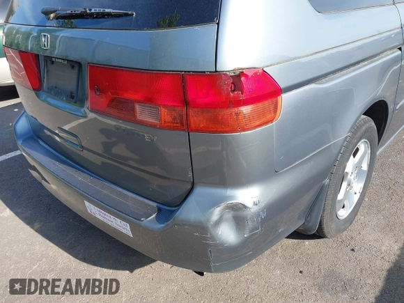 2000 Honda Odyssey EX z VIN 2HKRL1869YH531628, wystawiony jako IAAI lot #42482459 z przebiegiem 117 118 mil mil oraz . Historia ofert i sprzedaży dostępna na DreamBid. Obrazek 6.
