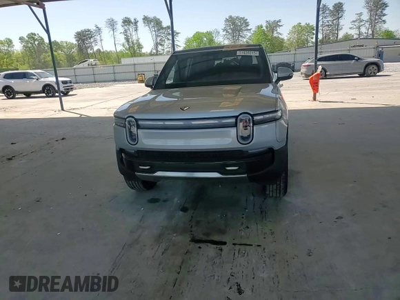 2025 Rivian R1S Adventure z VIN 7PDSGBBA9SN052652, wystawiony jako Copart lot #51659315 z przebiegiem 4012 mil mil oraz Szkody całkowita. Historia ofert i sprzedaży dostępna na DreamBid. Obrazek 11.