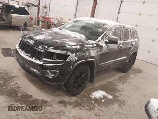 2016 Jeep Grand Cherokee Laredo with VIN 1C4RJFAGXGC311561, listed as a IAAI auction lot 41364024 with 134,042 mi miles. Bid and sale history available at carsss.com. Image 2.