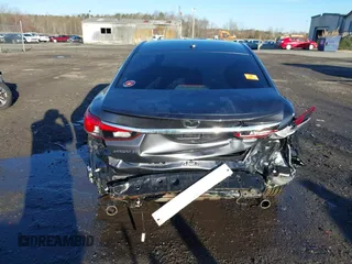 2014 Mazda 6 i Grand Touring with VIN JM1GJ1W50E1107877, listed as a IAAI auction lot 41857596 with 166,188 mi miles and . Bid and sale history available at DreamBid. Image 6.
