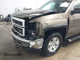2014 Chevrolet Silverado 1500 LT with VIN 1GCVKREC5EZ147506, listed as a IAAI auction lot 41736960 with 112,399 mi miles and . Bid and sale history available at DreamBid. Image 6.