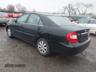 2003 Toyota Camry LE with VIN 4T1BE30K13U144114, listed as a IAAI auction lot 41829879 with 60,385 mi miles and . Bid and sale history available at DreamBid. Image 3.