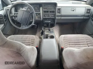 1995 Jeep Grand Cherokee Laredo with VIN 1J4GZ58Y6SC718918, listed as a Copart auction lot 72226394 with 212,670 mi miles and Salvage Title. Bid and sale history available at carsss.com. Image 8.
