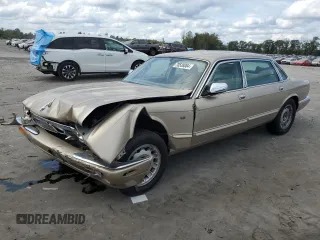 1999 Jaguar XJ z VIN SAJKX6048XC849376, wystawiony jako Copart lot #70538064 z przebiegiem 122 891 mil mil oraz Szkoda całkowita • Salvage title. Historia ofert i sprzedaży dostępna na DreamBid. Obrazek 1.