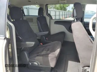 2014 Dodge Grand Caravan SXT z VIN 2C4RDGCG8ER266814, wystawiony jako Copart lot #52053155 z przebiegiem 279 551 mil mil oraz Tytuł czysty. Historia ofert i sprzedaży dostępna na DreamBid. Obrazek 11.