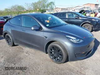 2021 Tesla Model Y Long Range with VIN 5YJYGAEE1MF149887, listed as a IAAI auction lot 42032104 with 54,932 mi miles. Bid and sale history available at carsss.com. Image 1.